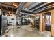 Unfinished basement featuring work-out equipment, exposed ductwork, and access to other rooms at 3113 Octavia Pl, Atlanta, GA 30340