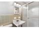 Modest bathroom features a pedestal sink and shower with glass door at 3113 Octavia Pl, Atlanta, GA 30340