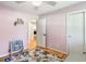Small bedroom featuring a ceiling fan, hardwood floors, open doorway, and a closet at 3113 Octavia Pl, Atlanta, GA 30340