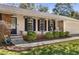 Close-up of the home's exterior, showcasing the detailed trim, black shutters, and freshly painted front door at 3113 Octavia Pl, Atlanta, GA 30340