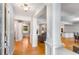 Spacious foyer featuring hardwood floors, decorative columns, and an open view to the dining and living areas at 3113 Octavia Pl, Atlanta, GA 30340