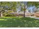 Attractive single-story home boasts a lush green lawn and mature shade trees in a desirable neighborhood at 3113 Octavia Pl, Atlanta, GA 30340