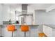 Bright kitchen featuring white cabinets, stainless steel appliances, and granite countertops with barstool seating at 3113 Octavia Pl, Atlanta, GA 30340