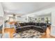 Open-concept living space featuring a modern kitchen, dining area, and comfortable living room with fireplace at 3113 Octavia Pl, Atlanta, GA 30340