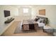 Cozy bedroom features a bed and mounted TV above floating console at 1075 Peachtree Ne Walk # A519, Atlanta, GA 30309