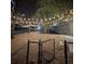 Apartment dog park in a common area with lights for nighttime use and a skyline view at 1075 Peachtree Ne Walk # A519, Atlanta, GA 30309