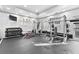 Well-equipped gym with weightlifting machines, free weights, and a television for entertainment at 1075 Peachtree Ne Walk # A519, Atlanta, GA 30309