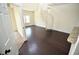 Bright living room with dark hardwood floors and a unique spiral staircase at 1075 Peachtree Ne Walk # A519, Atlanta, GA 30309