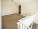 Cozy loft area featuring neutral carpeting and a walk-in closet, perfect for a reading nook at 1075 Peachtree Ne Walk # A519, Atlanta, GA 30309