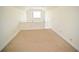 Bright loft area featuring neutral carpeting and a window offering natural light at 1075 Peachtree Ne Walk # A519, Atlanta, GA 30309