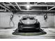 Sleek black car parked in a modern garage with charging stations at 1075 Peachtree Ne Walk # A519, Atlanta, GA 30309