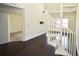 Modern interior design with a spiral staircase and rich hardwood floors at 1075 Peachtree Ne Walk # A519, Atlanta, GA 30309