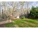 Scenic view of the backyard and wooded area with a small storage shed at 2923 Glenhaven Sw Ct, Conyers, GA 30094