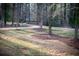 The property features a lush backyard surrounded by mature trees, creating a private oasis at 2923 Glenhaven Sw Ct, Conyers, GA 30094
