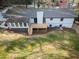 Home exterior features a deck and well-kept yard, and lush surrounding trees at 2923 Glenhaven Sw Ct, Conyers, GA 30094