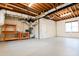 Bright unfinished basement with exposed ductwork and gray floors offering plenty of potential at 2923 Glenhaven Sw Ct, Conyers, GA 30094