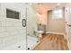 Modern bathroom featuring a glass enclosed shower, white subway tile, and gray vanity with granite countertops at 2923 Glenhaven Sw Ct, Conyers, GA 30094