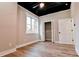 Bright bedroom showcasing new vinyl floors, neutral paint, white trim, and closet for storage at 2923 Glenhaven Sw Ct, Conyers, GA 30094