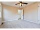 Bedroom featuring carpet flooring, a ceiling fan, closet, and bright natural lighting at 2923 Glenhaven Sw Ct, Conyers, GA 30094