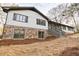 Charming home featuring a stone foundation and a well-manicured front yard at 2923 Glenhaven Sw Ct, Conyers, GA 30094