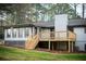 Renovated house featuring a back porch and white painted brick at 2923 Glenhaven Sw Ct, Conyers, GA 30094