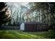 The property features a covered metal outbuilding offering versatile use options at 2923 Glenhaven Sw Ct, Conyers, GA 30094