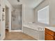 Bathroom featuring a soaking tub, separate shower, and vanity at 3285 Pebble Ridge Ln, Buford, GA 30519
