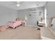 Bright bedroom with a dresser, single bed, large window, and neutral carpet at 3285 Pebble Ridge Ln, Buford, GA 30519
