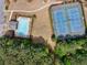 Aerial view of a community pool and tennis courts surrounded by green trees at 3285 Pebble Ridge Ln, Buford, GA 30519