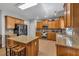 Open kitchen featuring granite countertops, stainless steel appliances, and a center island with barstool seating at 3285 Pebble Ridge Ln, Buford, GA 30519