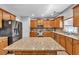 Featuring stainless steel appliances, granite countertops, and a center island, this kitchen is a chef's dream at 3285 Pebble Ridge Ln, Buford, GA 30519