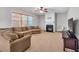 Cozy living room with a fireplace and large windows at 3285 Pebble Ridge Ln, Buford, GA 30519