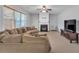 Spacious living room with a fireplace and large windows at 3285 Pebble Ridge Ln, Buford, GA 30519