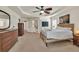 Bright and spacious main bedroom featuring neutral walls, a ceiling fan, and cozy, carpeted floors at 3285 Pebble Ridge Ln, Buford, GA 30519