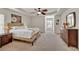 Spacious main bedroom with tray ceiling, ceiling fan, and neutral-toned carpet at 3285 Pebble Ridge Ln, Buford, GA 30519