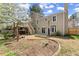 Well-maintained backyard features a deck, hot tub, and lush landscaping for outdoor enjoyment at 465 Hunt River Way, Suwanee, GA 30024
