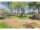 Large backyard with wood fence providing privacy and lush landscaping at 465 Hunt River Way, Suwanee, GA 30024