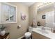 Clean bathroom with a single sink vanity, modern fixtures, and neutral wall paint at 465 Hunt River Way, Suwanee, GA 30024