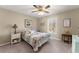 Charming bedroom with a floral quilt, neutral walls, and natural light from a window at 465 Hunt River Way, Suwanee, GA 30024