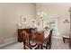 Cozy dining room featuring a large window, natural light and classic furnishings at 465 Hunt River Way, Suwanee, GA 30024