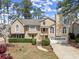 Charming two-story home with manicured front lawn and two-car garage and elegant entrance, perfect for Gathering living at 465 Hunt River Way, Suwanee, GA 30024