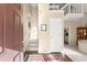 Bright foyer with wood floors, stairs and second level balcony creating an open and inviting entryway at 465 Hunt River Way, Suwanee, GA 30024