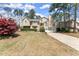 Traditional two-story home with an attached two-car garage and well-manicured lawn at 465 Hunt River Way, Suwanee, GA 30024