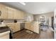 Well-lit kitchen with light cabinetry, modern appliances, and an adjacent eat-in dining area at 465 Hunt River Way, Suwanee, GA 30024