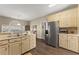 Spacious kitchen featuring wood cabinets, stainless steel appliances, and plenty of counter space at 465 Hunt River Way, Suwanee, GA 30024
