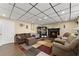 Cozy living room features a fireplace, comfortable seating, and a stylish area rug at 465 Hunt River Way, Suwanee, GA 30024