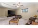 Cozy living room with a large TV, beanbag chair, and comfortable seating area at 465 Hunt River Way, Suwanee, GA 30024
