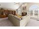 Open living room featuring a fireplace, built-in shelving, and abundant natural light at 465 Hunt River Way, Suwanee, GA 30024