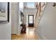 Welcoming foyer features hardwood floors, a decorative front door, and a staircase leading to the upper level at 155 Woodcreek Ln, Fayetteville, GA 30215