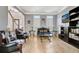 Elegant living room featuring hardwood floors, neutral paint, and stylish furniture at 155 Woodcreek Ln, Fayetteville, GA 30215